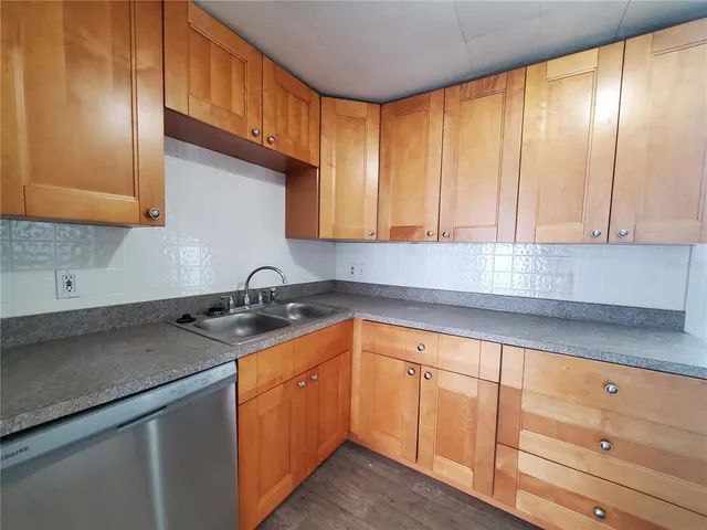 a kitchen with a sink and cabinets