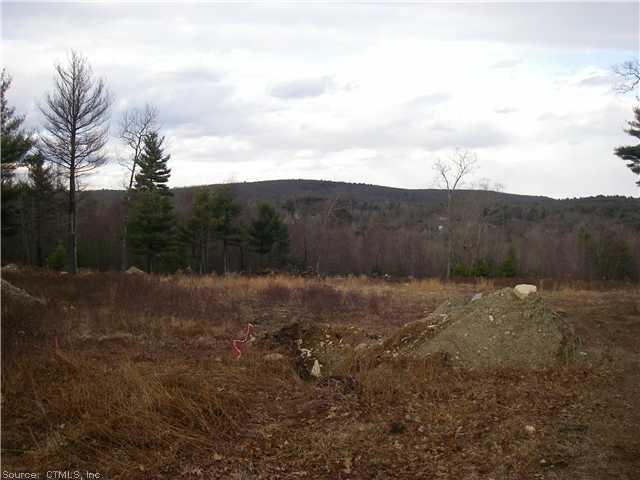 317 Valley Road Killingly, CT 06239 - Photo 1 of 1 a view of a dry yard with wooden fence