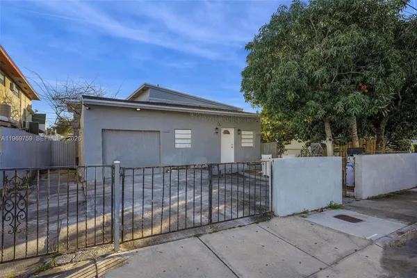 a side view of a house with a garage
