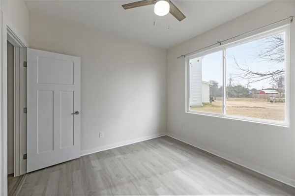 a view of an empty room with a window
