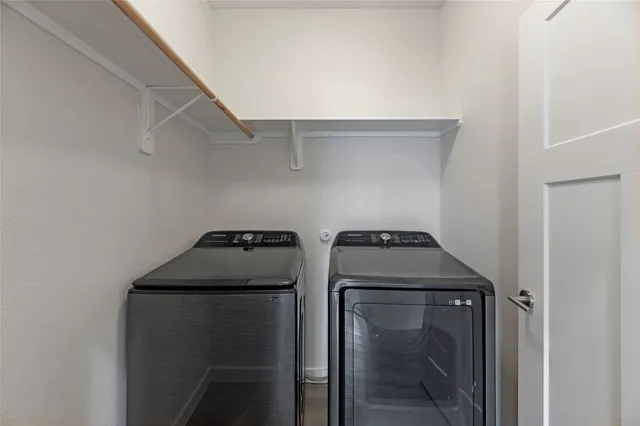 a bathroom with a granite countertop sink toilet mirror and shower