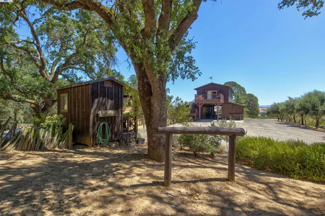 a view of a bench in a backyard