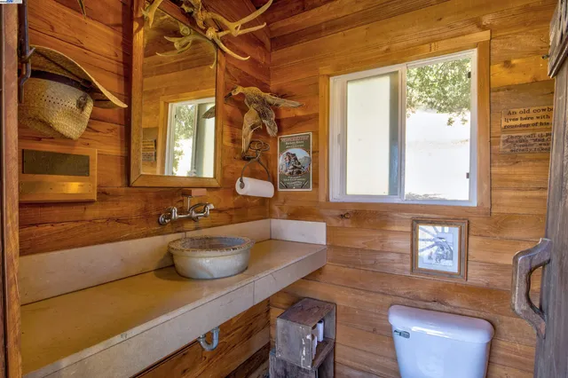 a bathroom with a sink a bathtub and window