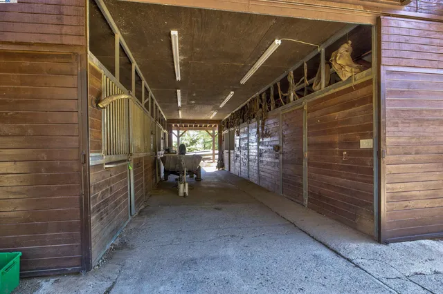 a view of an empty room with a brick wall