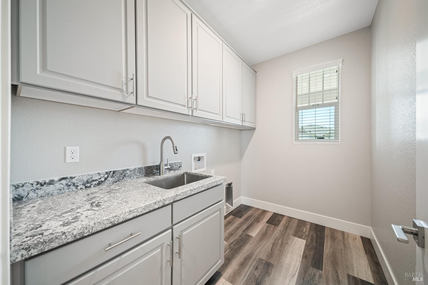 2194 Rustic Oak Lane Rio Vista, CA 94571 - Photo 11 of 20 a kitchen with granite countertop white cabinets and sink