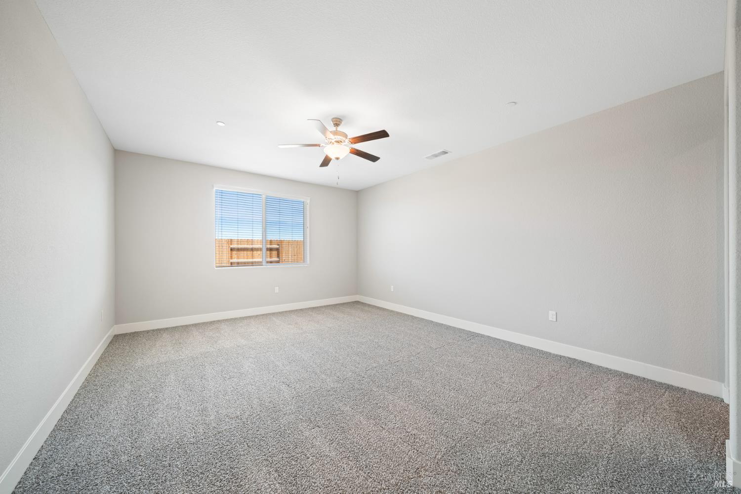 2194 Rustic Oak Lane Rio Vista, CA 94571 - Photo 13 of 20 an empty room with a window and a ceiling fan