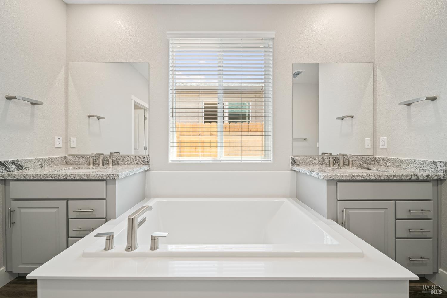 2194 Rustic Oak Lane Rio Vista, CA 94571 - Photo 18 of 20 a white bath tub sitting next to a window