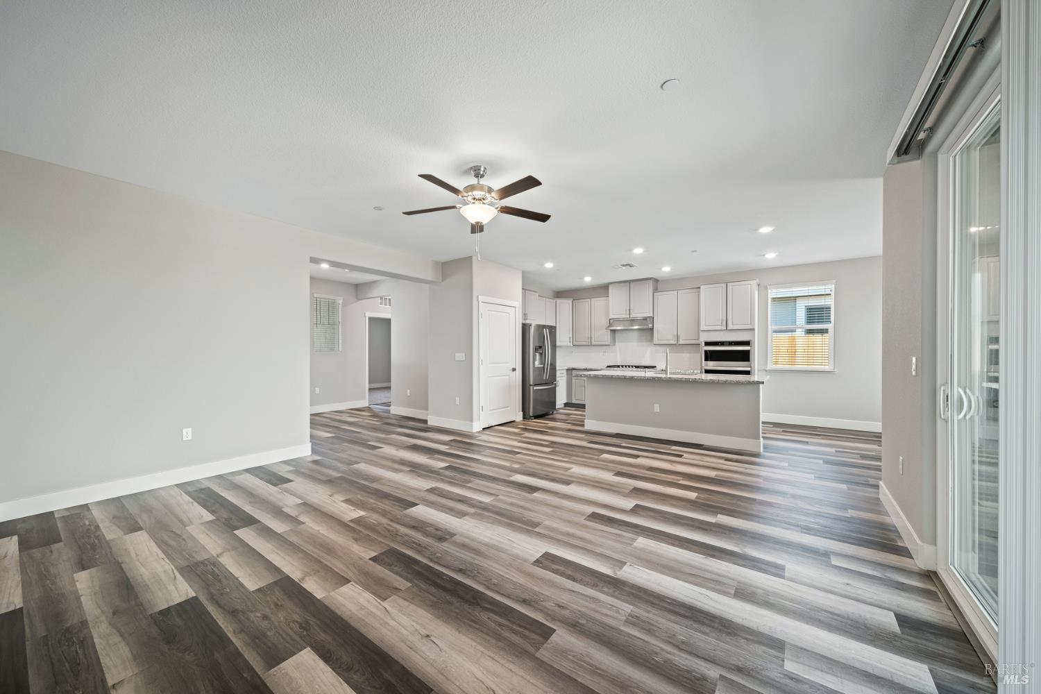 2194 Rustic Oak Lane Rio Vista, CA 94571 - Photo 2 of 20 a view of kitchen with kitchen island refrigerator stove and wooden floor