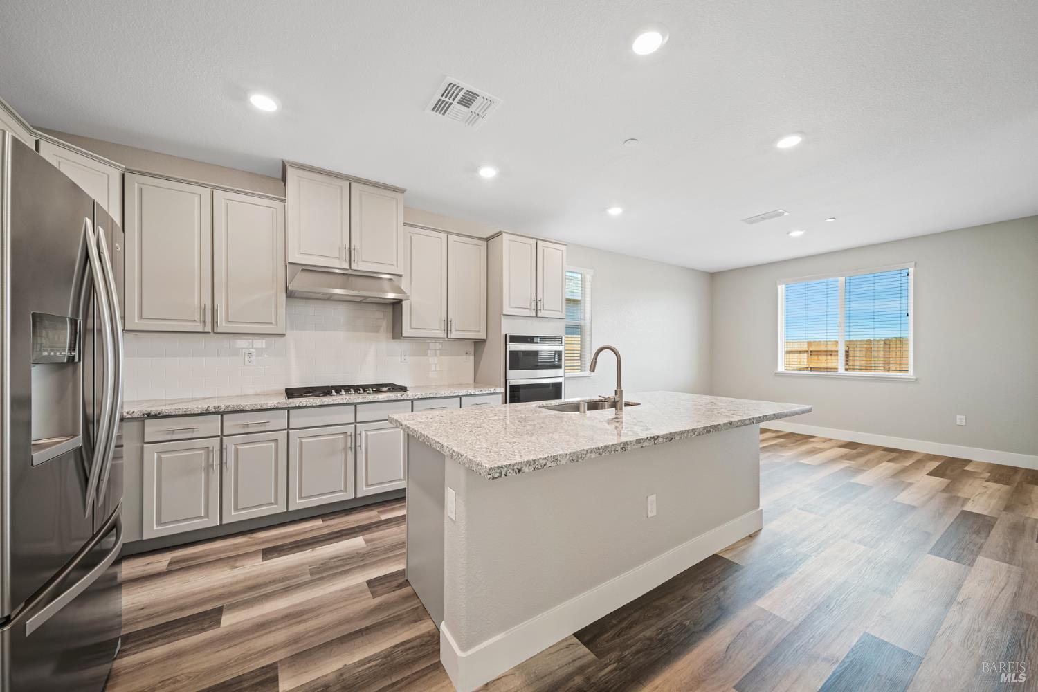 2194 Rustic Oak Lane Rio Vista, CA 94571 - Photo 5 of 20 a kitchen with stainless steel appliances granite countertop a sink stove and refrigerator