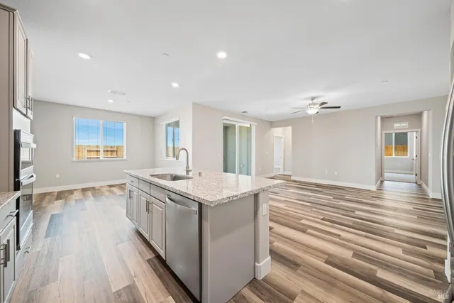 a room with a sink and a wooden floor