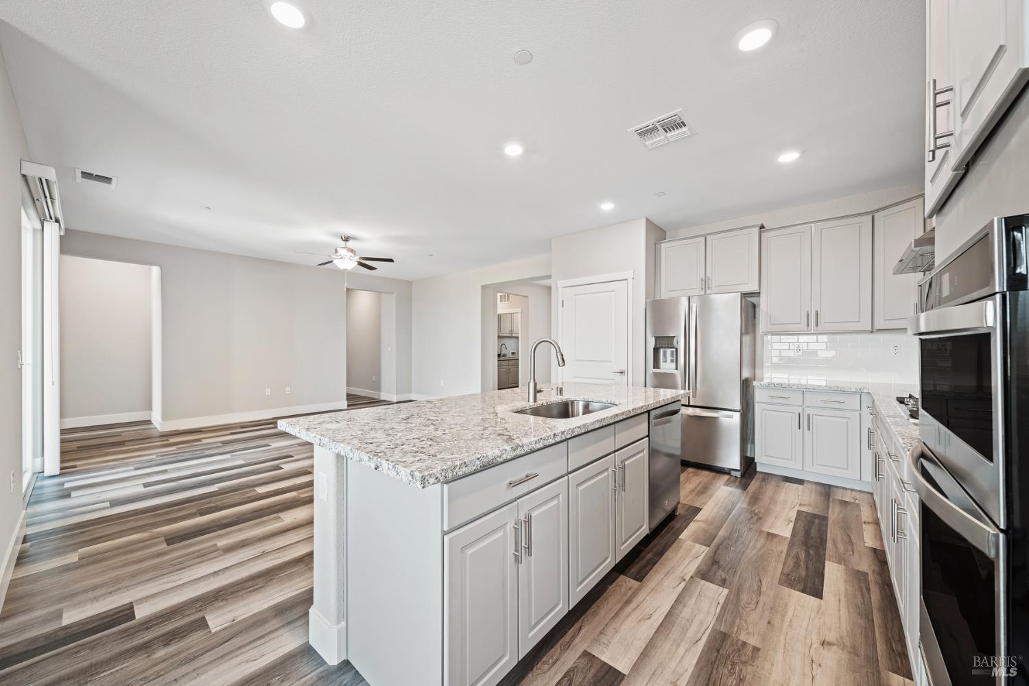 2194 Rustic Oak Lane Rio Vista, CA 94571 - Photo 7 of 20 a kitchen with stainless steel appliances granite countertop a sink stove and refrigerator