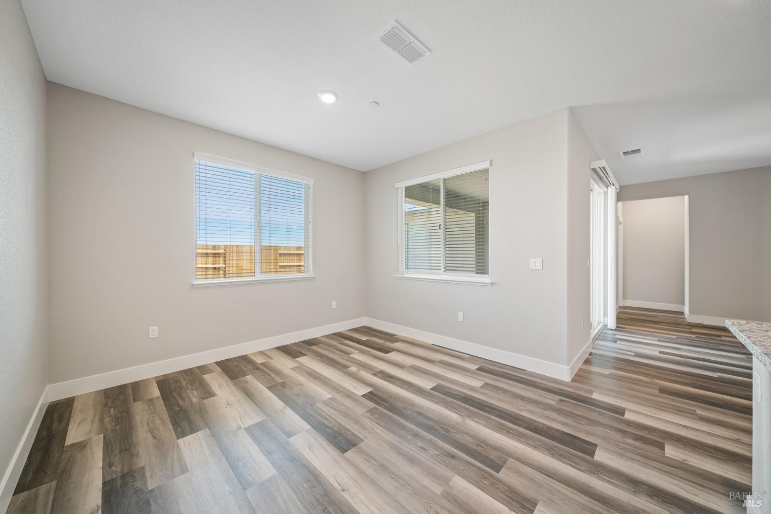 2194 Rustic Oak Lane Rio Vista, CA 94571 - Photo 8 of 20 a view of an empty room with wooden floor and a window