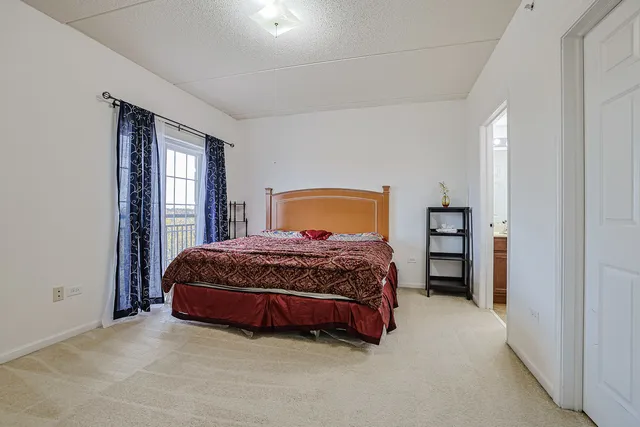 a bedroom with a bed and a closet