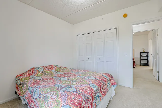 a bedroom with a bed and a cabinets