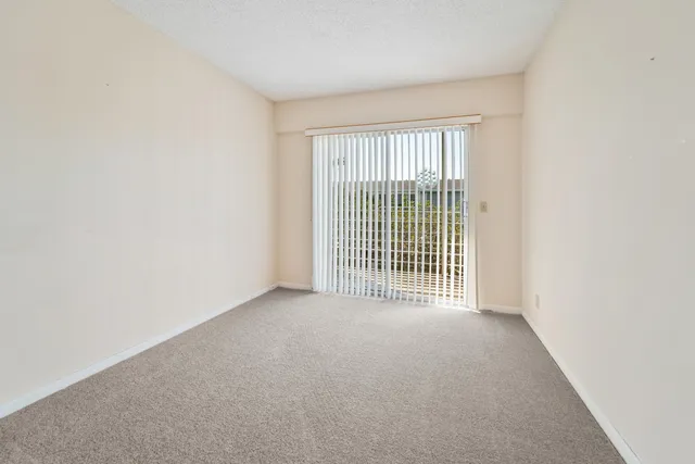 a view of a room with a large window