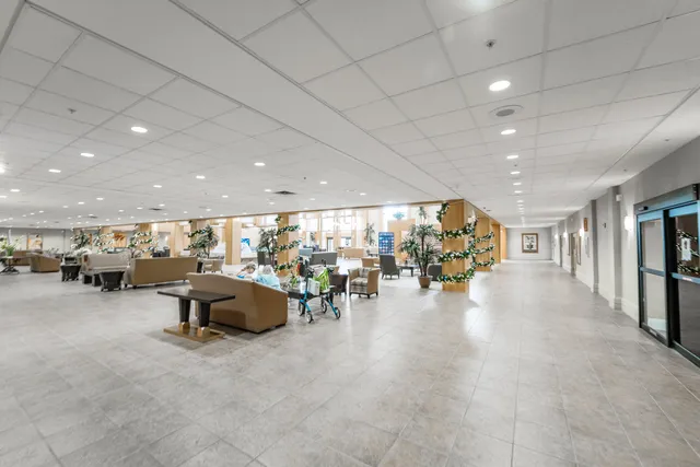 a room with lots of furniture and a chandelier