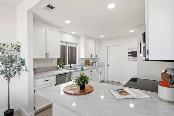 a kitchen with a table and chairs in it