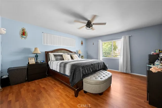 a bedroom with a bed and window