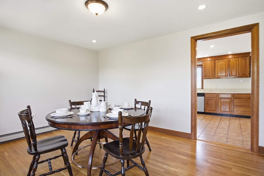50 Harborview Road Hull, MA 02045 - Photo 12 of 41 a view of a dining room with furniture and wooden floor