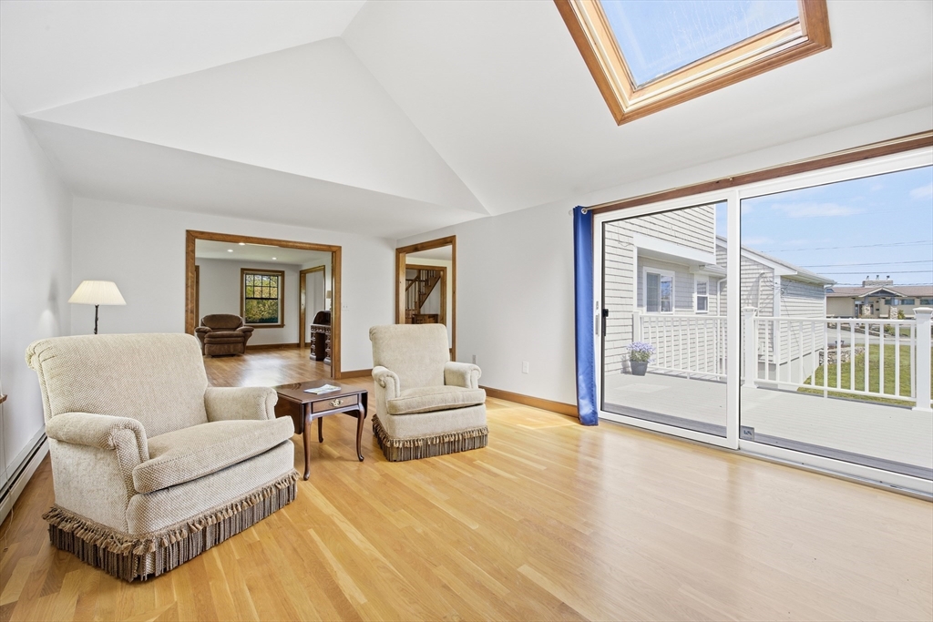 50 Harborview Road Hull, MA 02045 - Photo 13 of 41 a living room with furniture and a large window