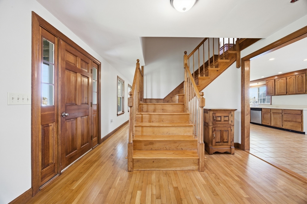 50 Harborview Road Hull, MA 02045 - Photo 15 of 41 a view of a hallway with wooden floor and staircase