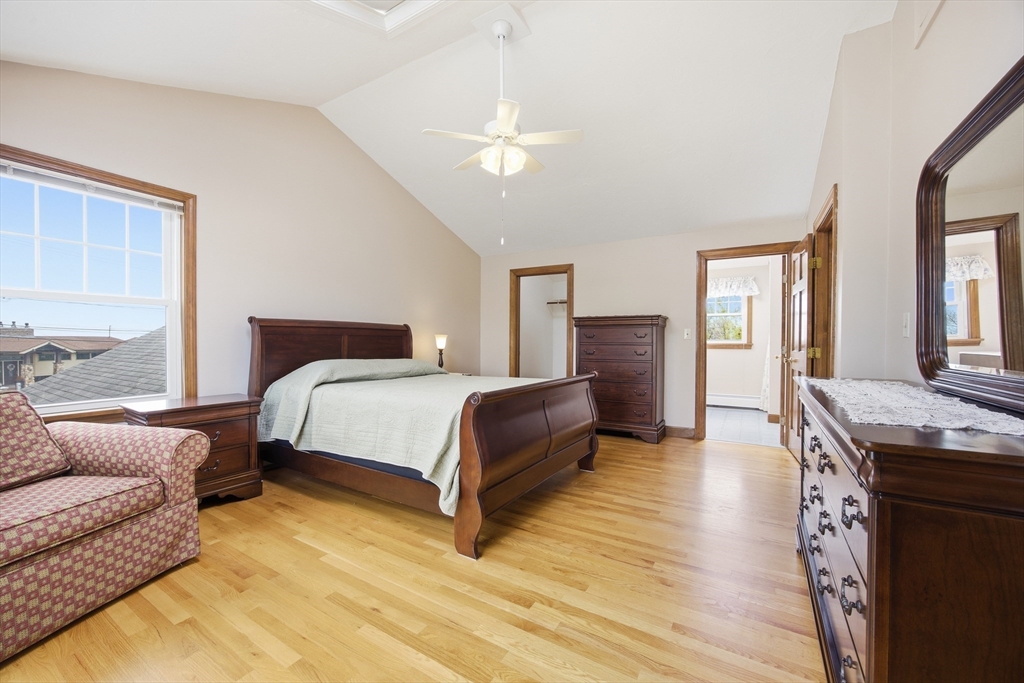50 Harborview Road Hull, MA 02045 - Photo 17 of 41 a bedroom with a bed and wooden floor