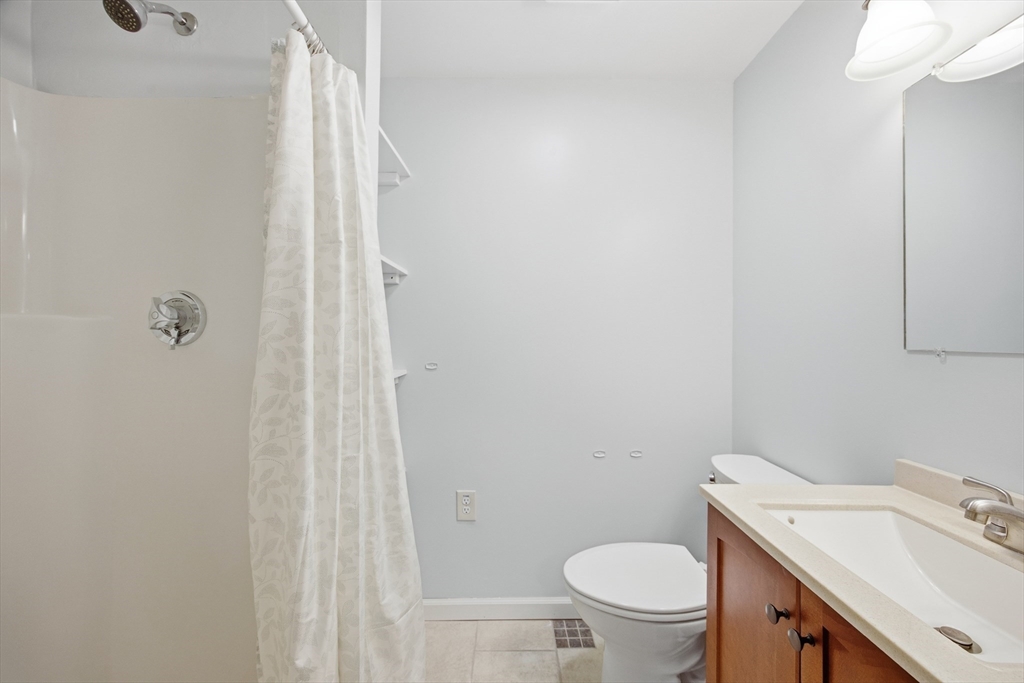 50 Harborview Road Hull, MA 02045 - Photo 27 of 41 a white toilet sitting next to a bathroom sink