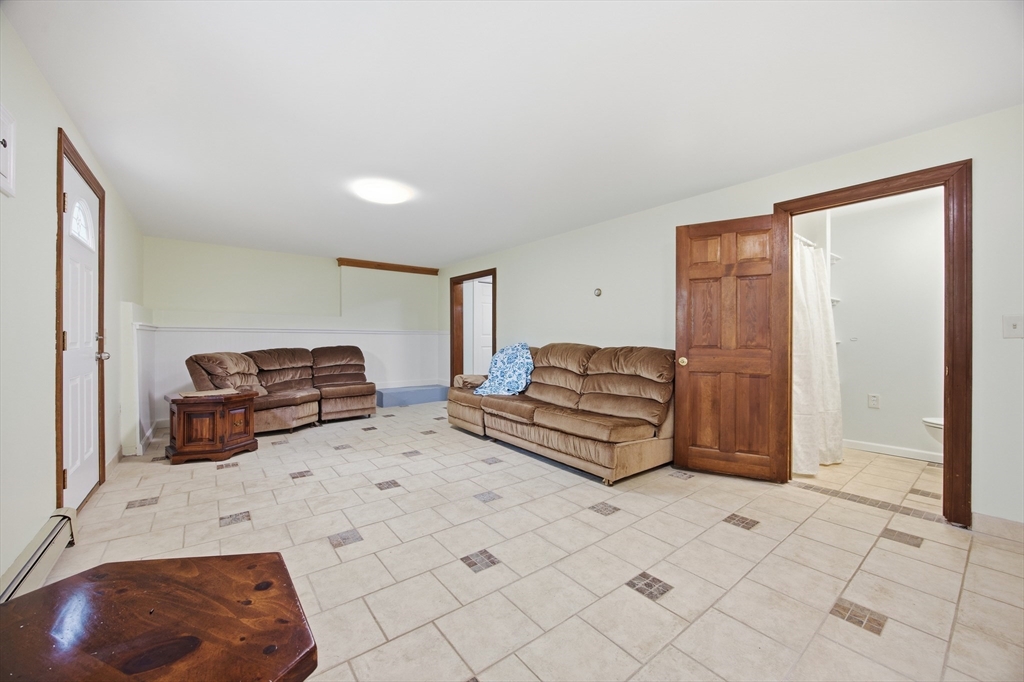 50 Harborview Road Hull, MA 02045 - Photo 29 of 41 a bedroom with a bed and a cabinets
