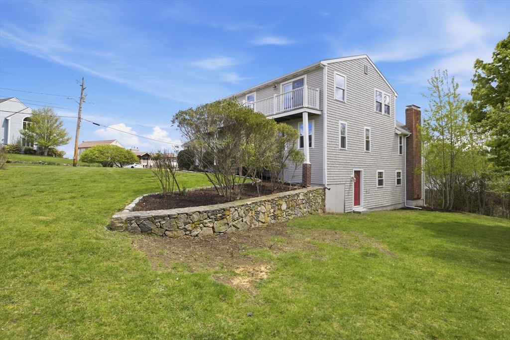 50 Harborview Road Hull, MA 02045 - Photo 3 of 41 a view of a big house with a big yard and large trees