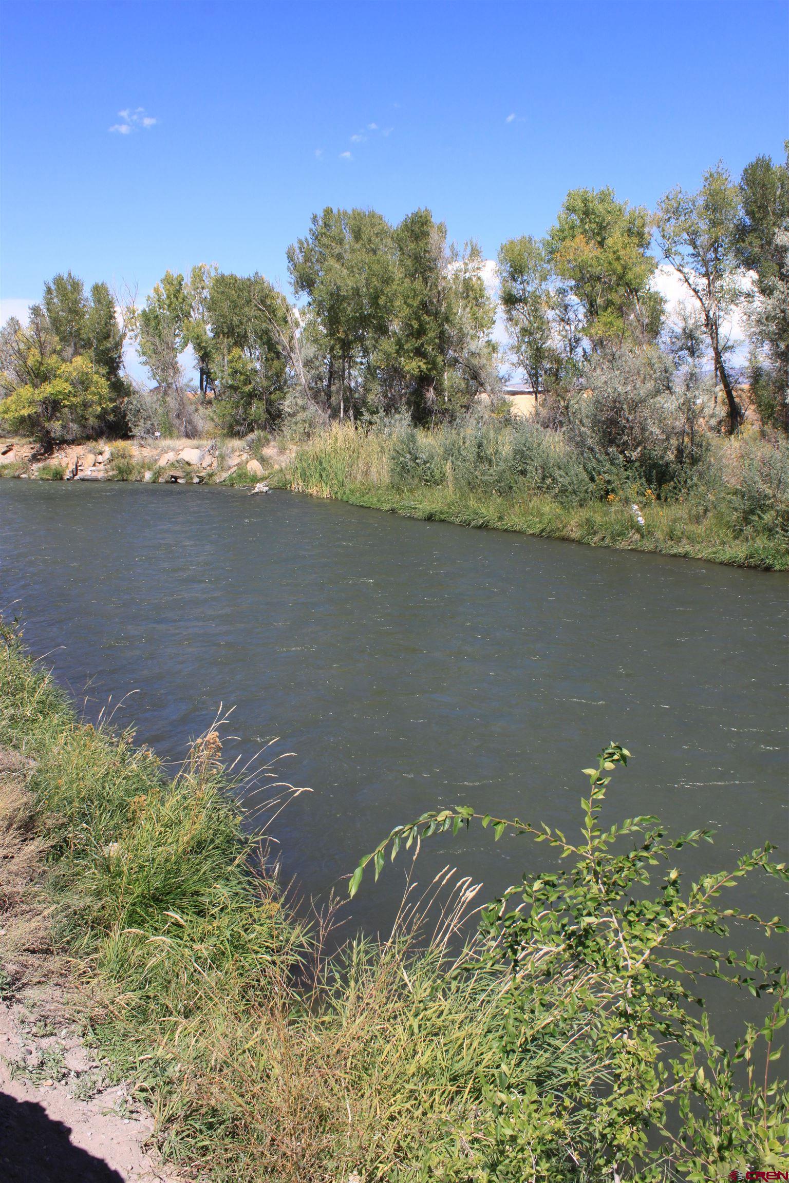 Tbd 6360th Road Montrose, CO 81403 - Photo 11 of 16 a view of a lake with a mountain