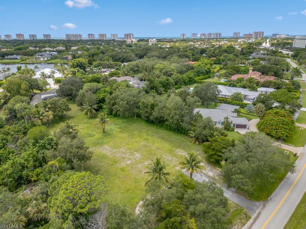 172 Hickory Road Naples, FL 34108 - Photo 7 of 11 an aerial view of residential houses with outdoor space and trees