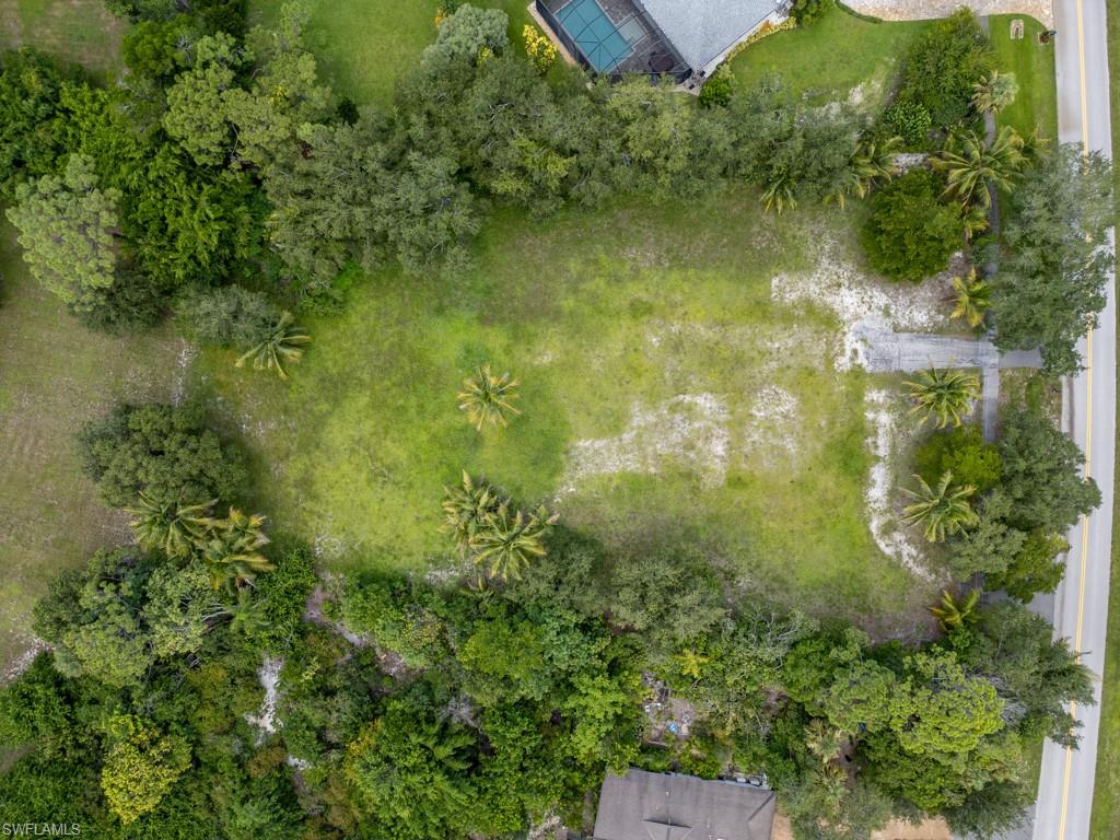 172 Hickory Road Naples, FL 34108 - Photo 8 of 11 an aerial view of residential houses with outdoor space and trees