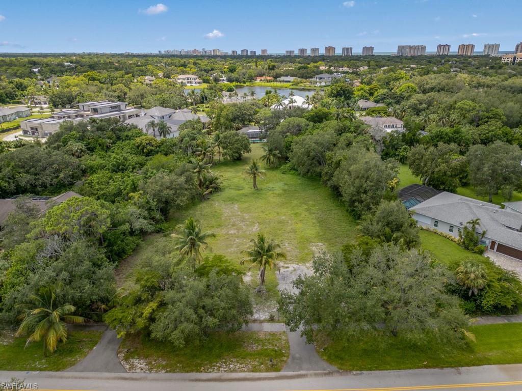 172 Hickory Road Naples, FL 34108 - Photo 10 of 11 an aerial view of residential houses with outdoor space and trees
