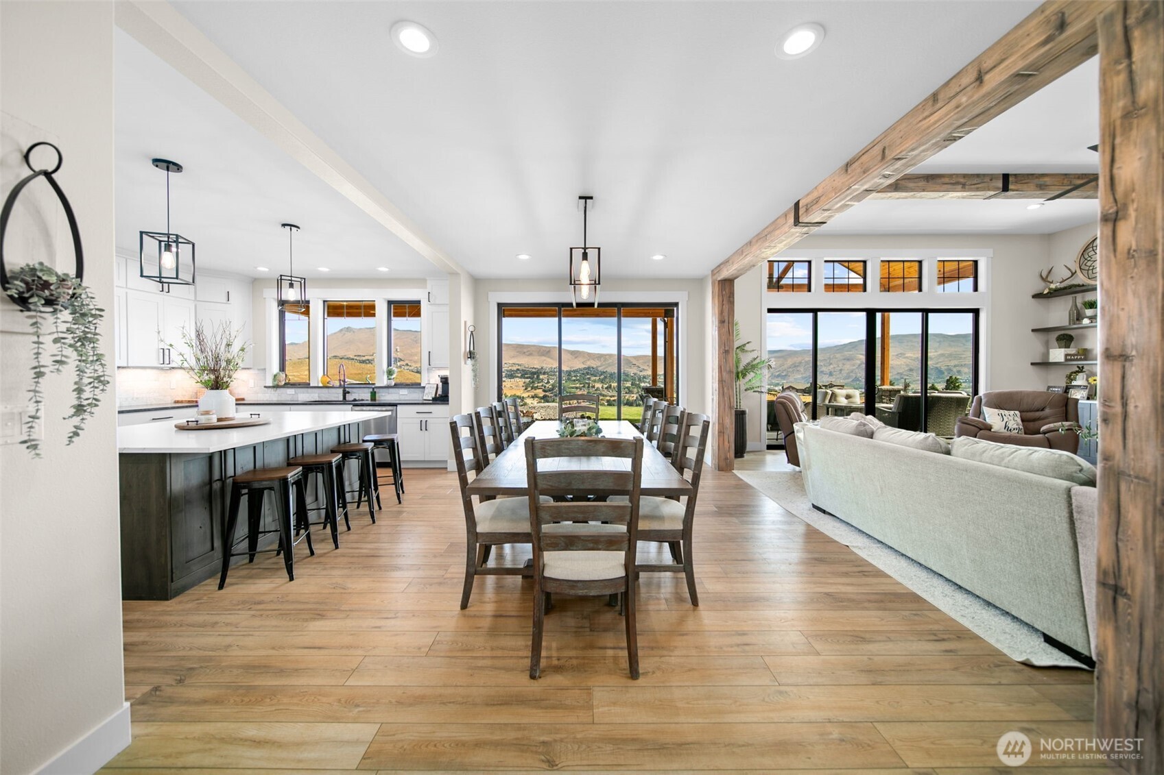 2002 North Road Wenatchee, WA 98801 - Photo 11 of 40 a dining hall with stainless steel appliances kitchen island granite countertop a dining table chairs and view living room