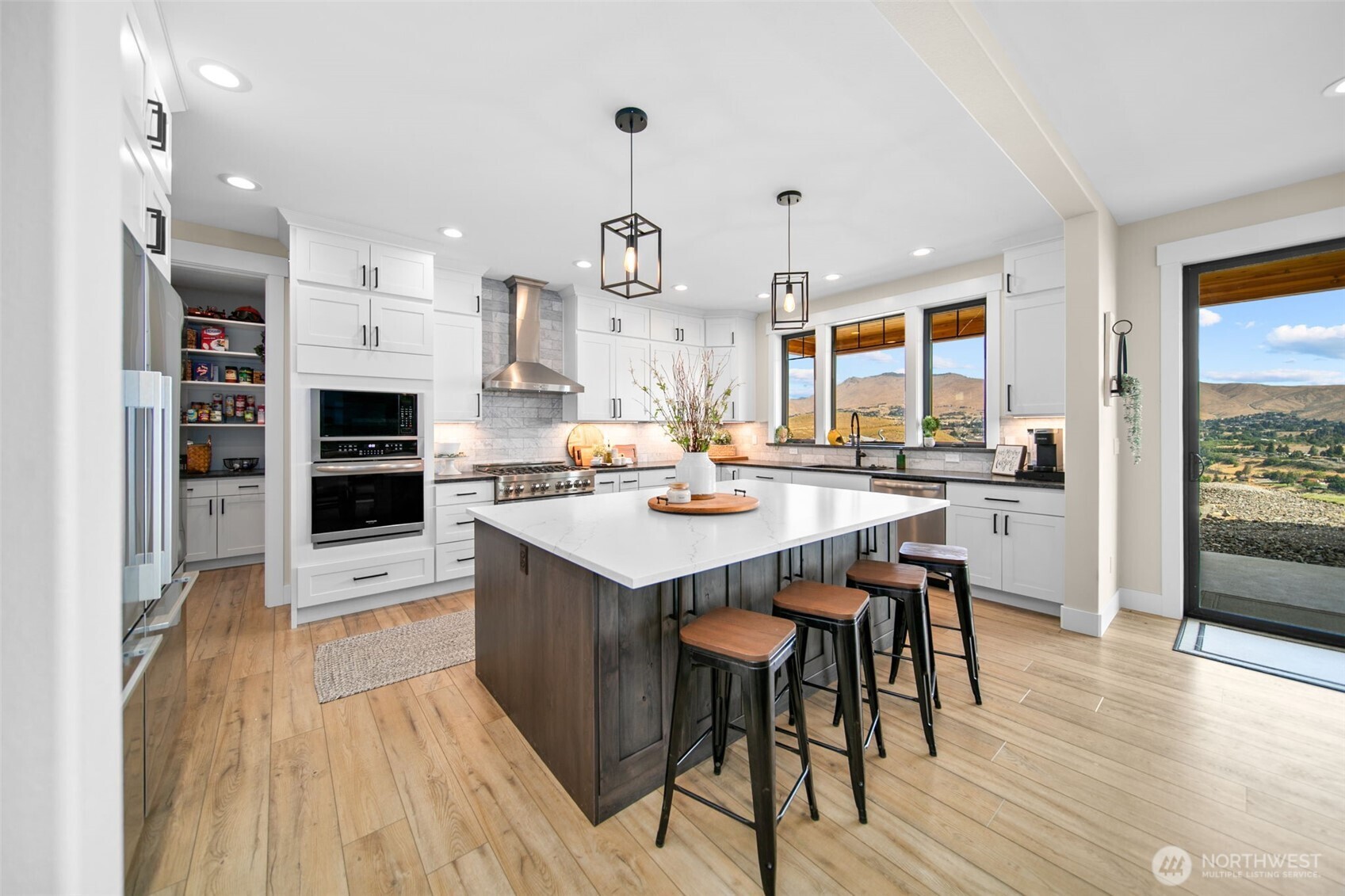 2002 North Road Wenatchee, WA 98801 - Photo 12 of 40 a large kitchen with a table and chairs