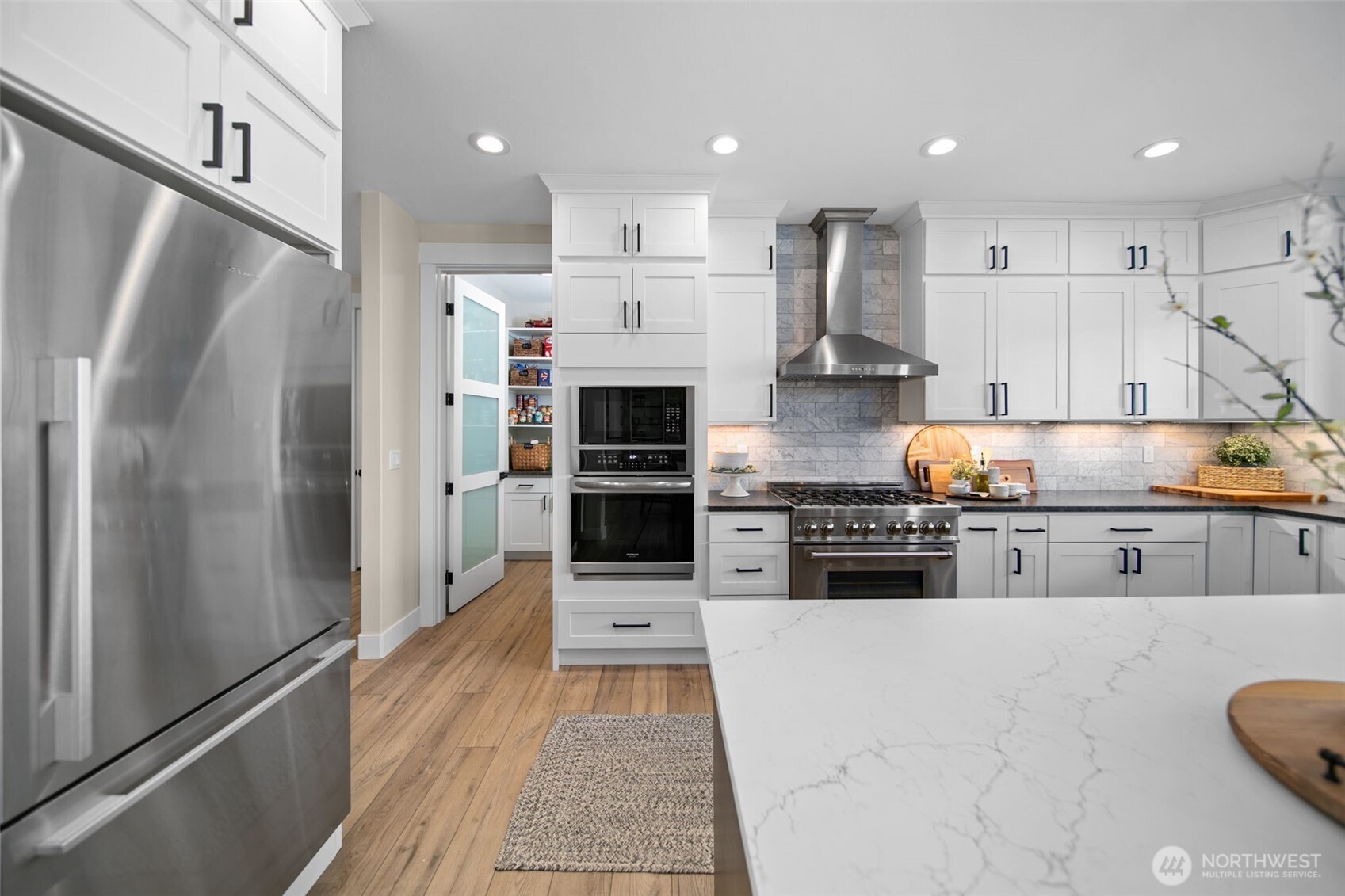 2002 North Road Wenatchee, WA 98801 - Photo 13 of 40 a kitchen with stainless steel appliances granite countertop a refrigerator and a stove