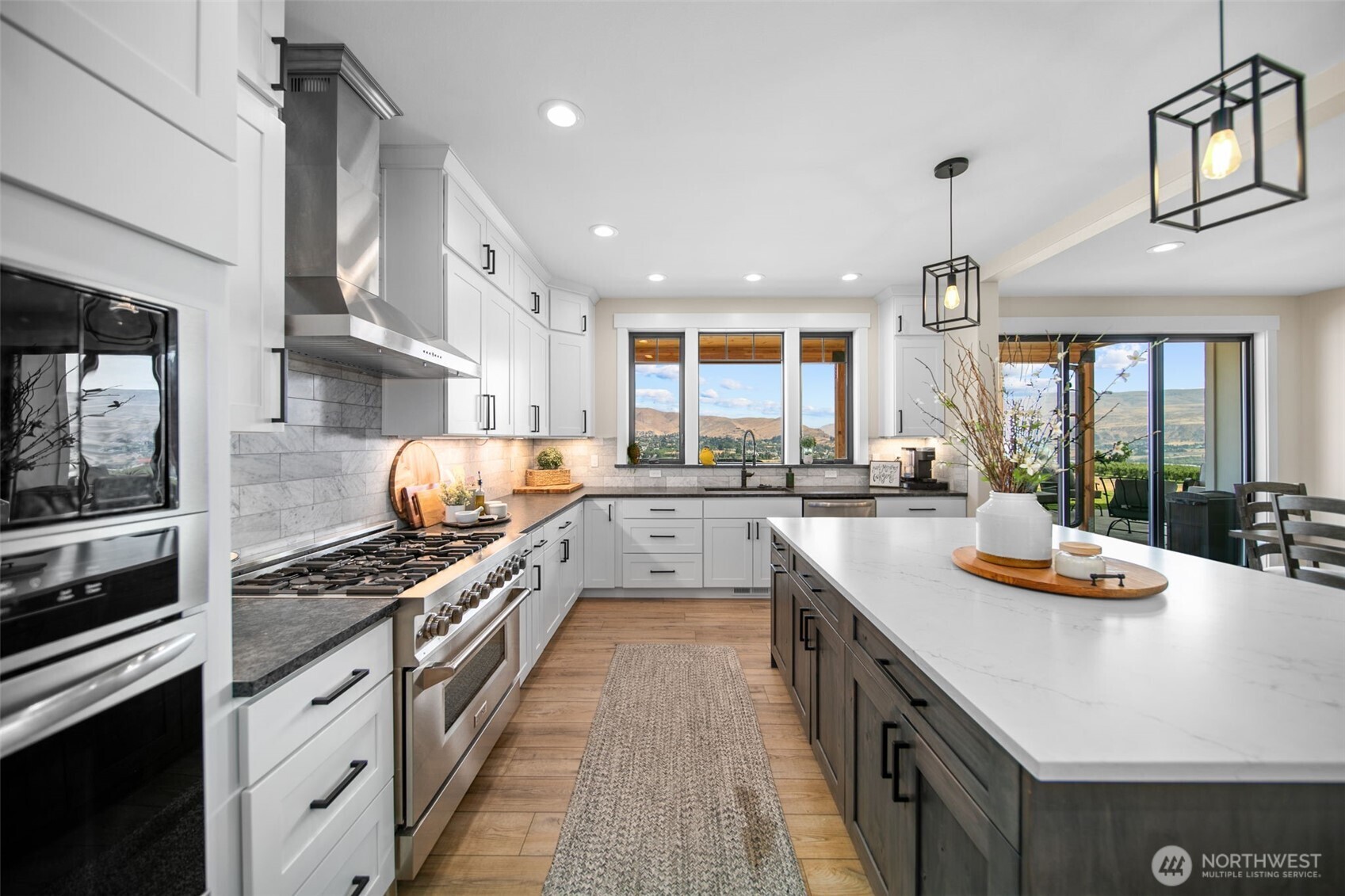 2002 North Road Wenatchee, WA 98801 - Photo 14 of 40 a kitchen with stainless steel appliances a sink a stove and cabinets