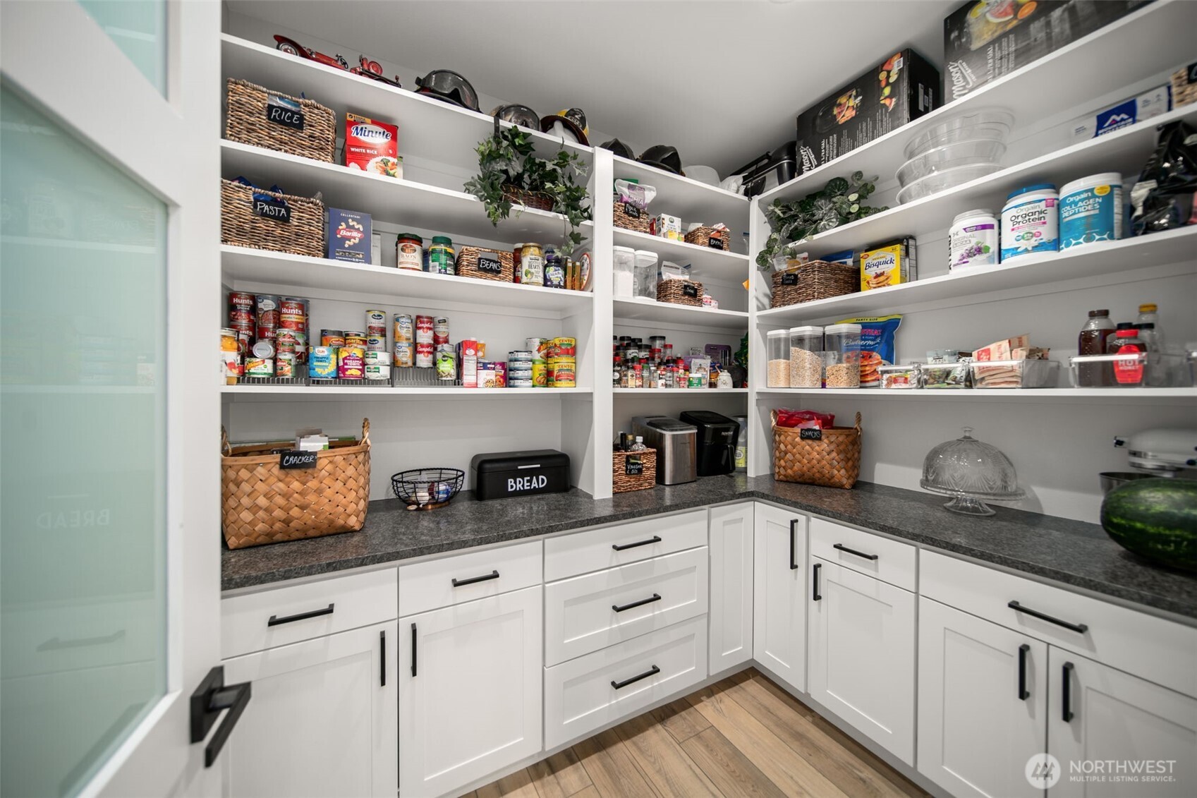 2002 North Road Wenatchee, WA 98801 - Photo 15 of 40 a kitchen with white cabinets and shelf