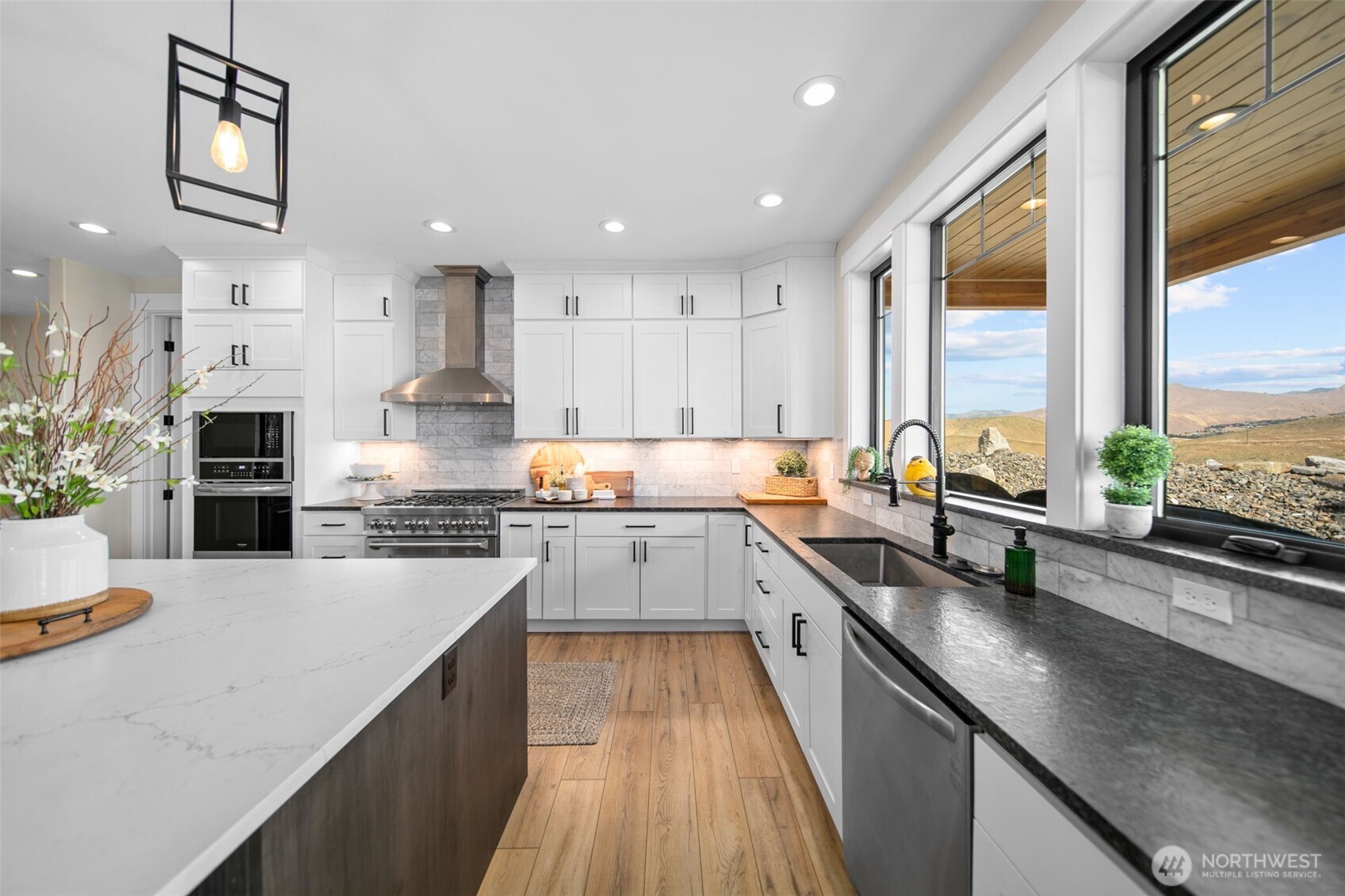 2002 North Road Wenatchee, WA 98801 - Photo 17 of 40 a kitchen with stainless steel appliances white cabinets a sink and a stove