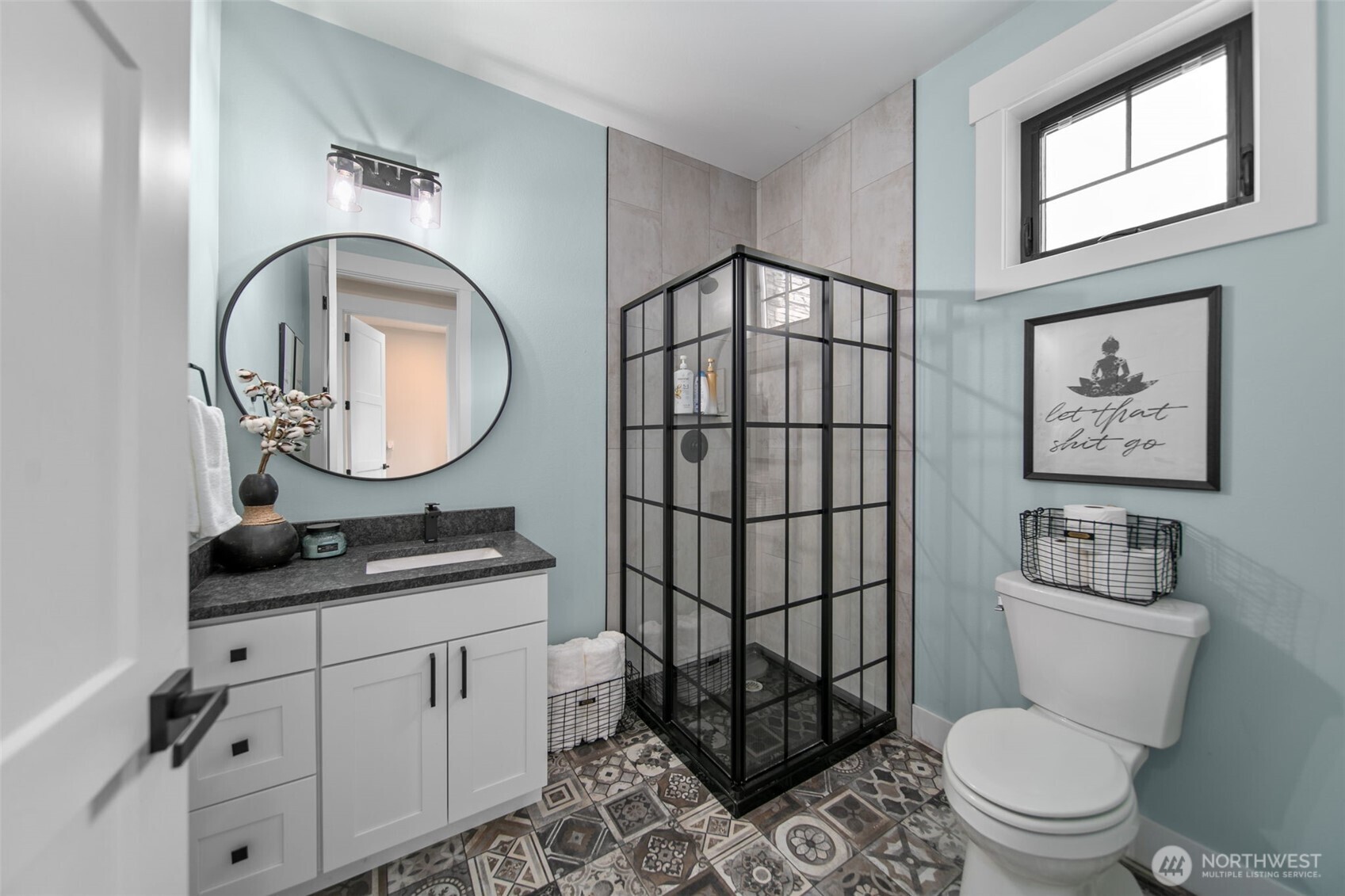 2002 North Road Wenatchee, WA 98801 - Photo 20 of 40 a bathroom with a toilet a sink and a mirror