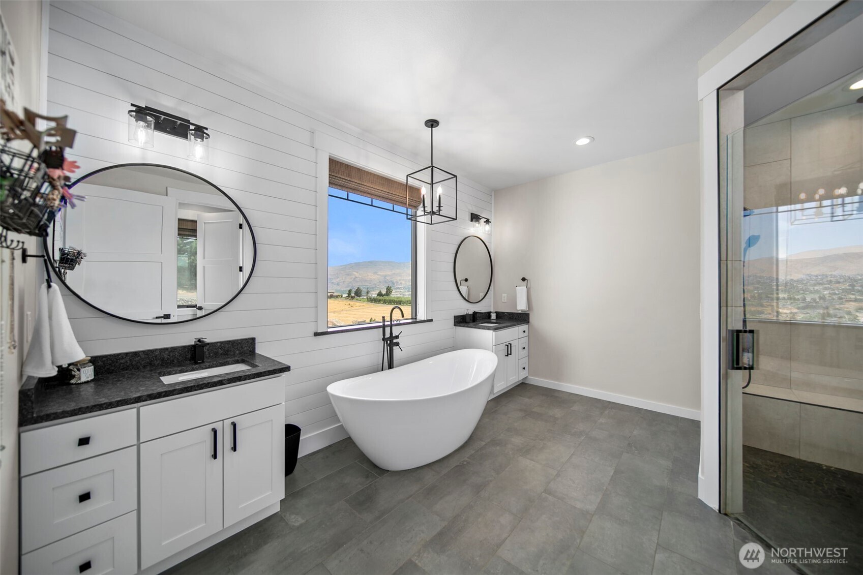 2002 North Road Wenatchee, WA 98801 - Photo 24 of 40 a bathroom with a double vanity sink mirror and bathtub
