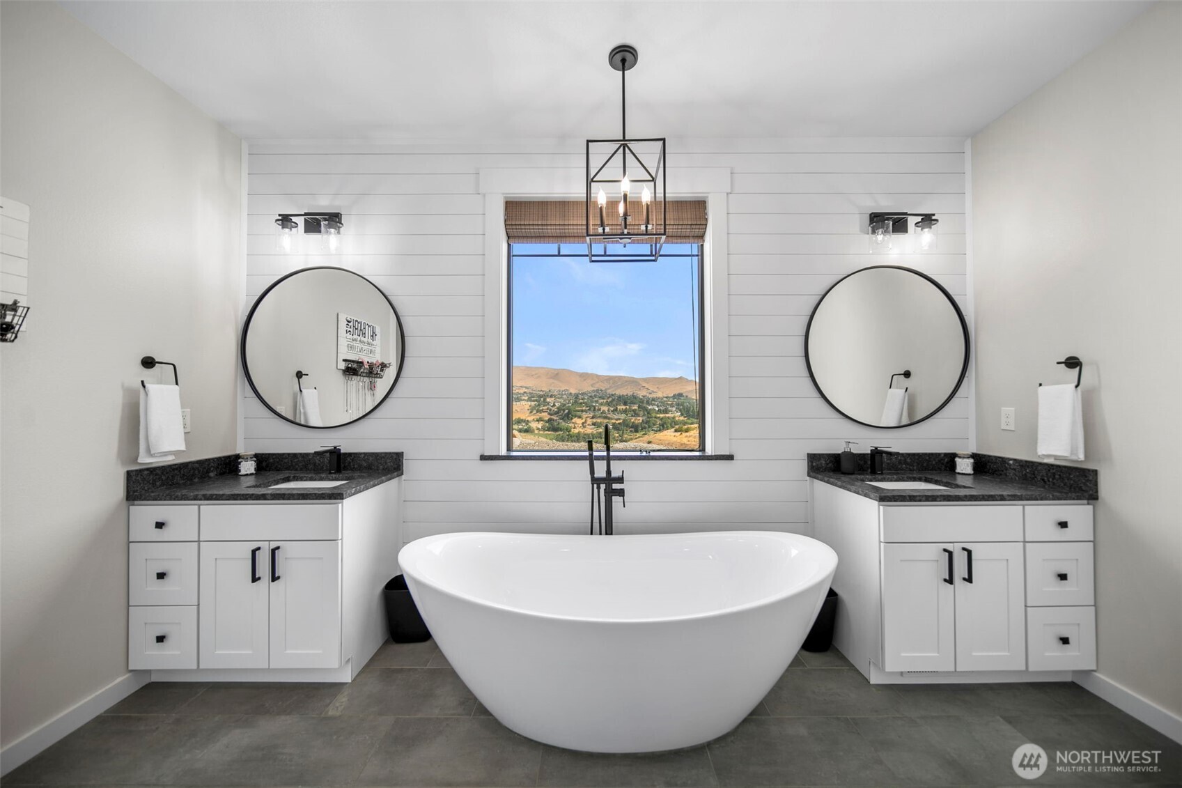 2002 North Road Wenatchee, WA 98801 - Photo 25 of 40 a spacious bathroom with a double vanity sink a mirror and a window