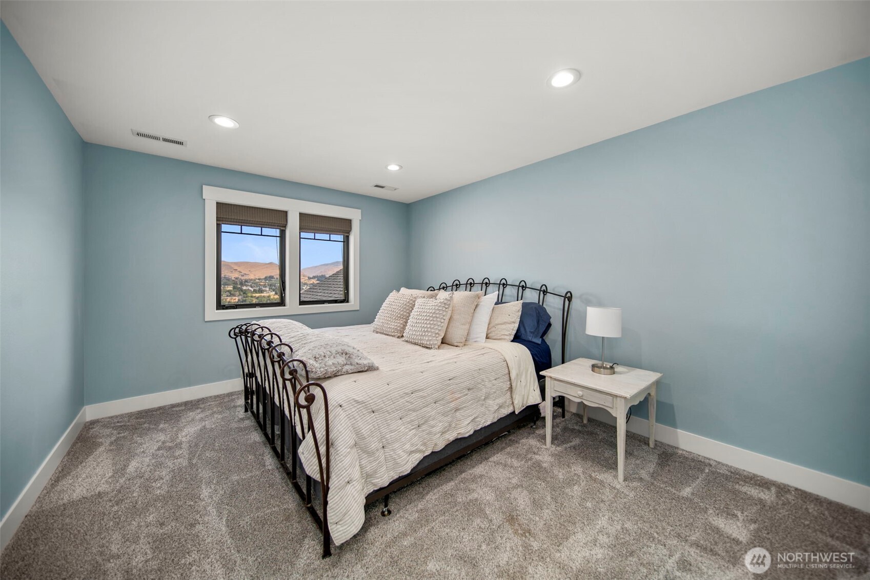 2002 North Road Wenatchee, WA 98801 - Photo 31 of 40 a bed room with a bed and a chair