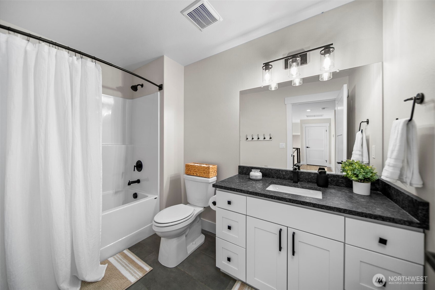 2002 North Road Wenatchee, WA 98801 - Photo 33 of 40 a spacious bathroom with a granite countertop sink a toilet and a mirror