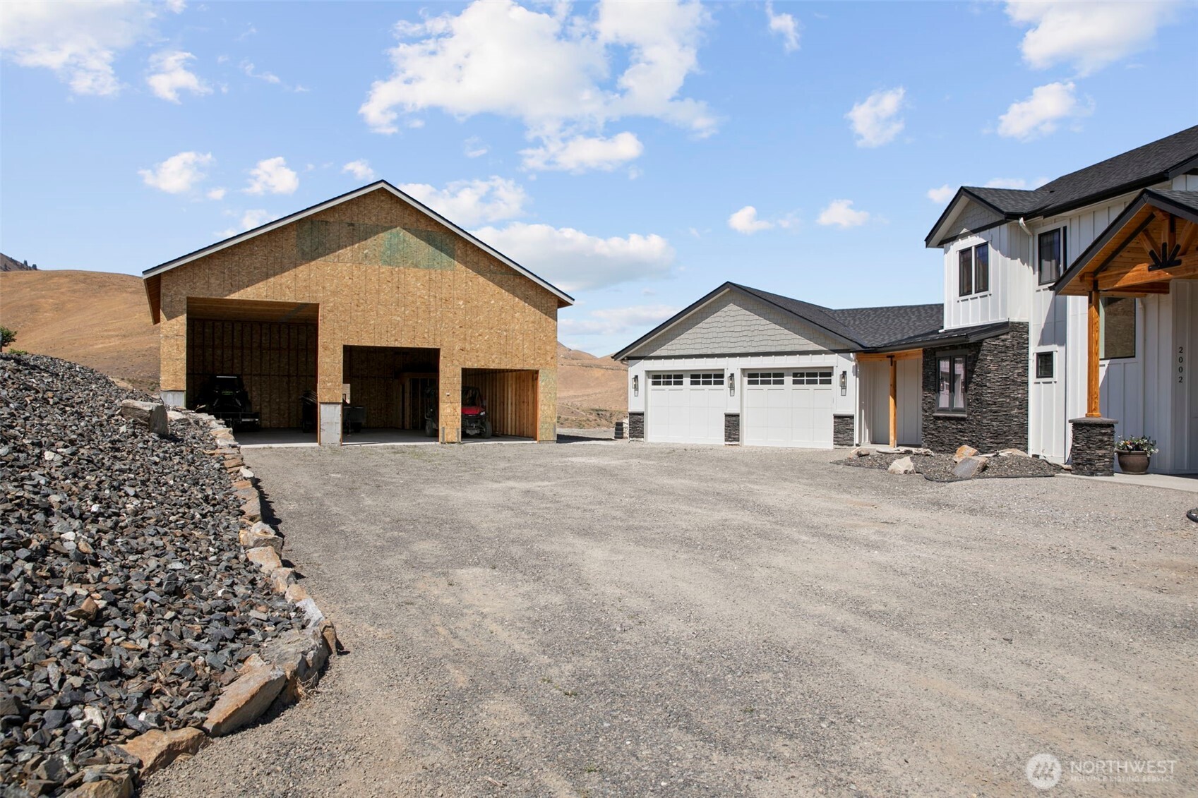 2002 North Road Wenatchee, WA 98801 - Photo 39 of 40 a view of a house with a yard and garage