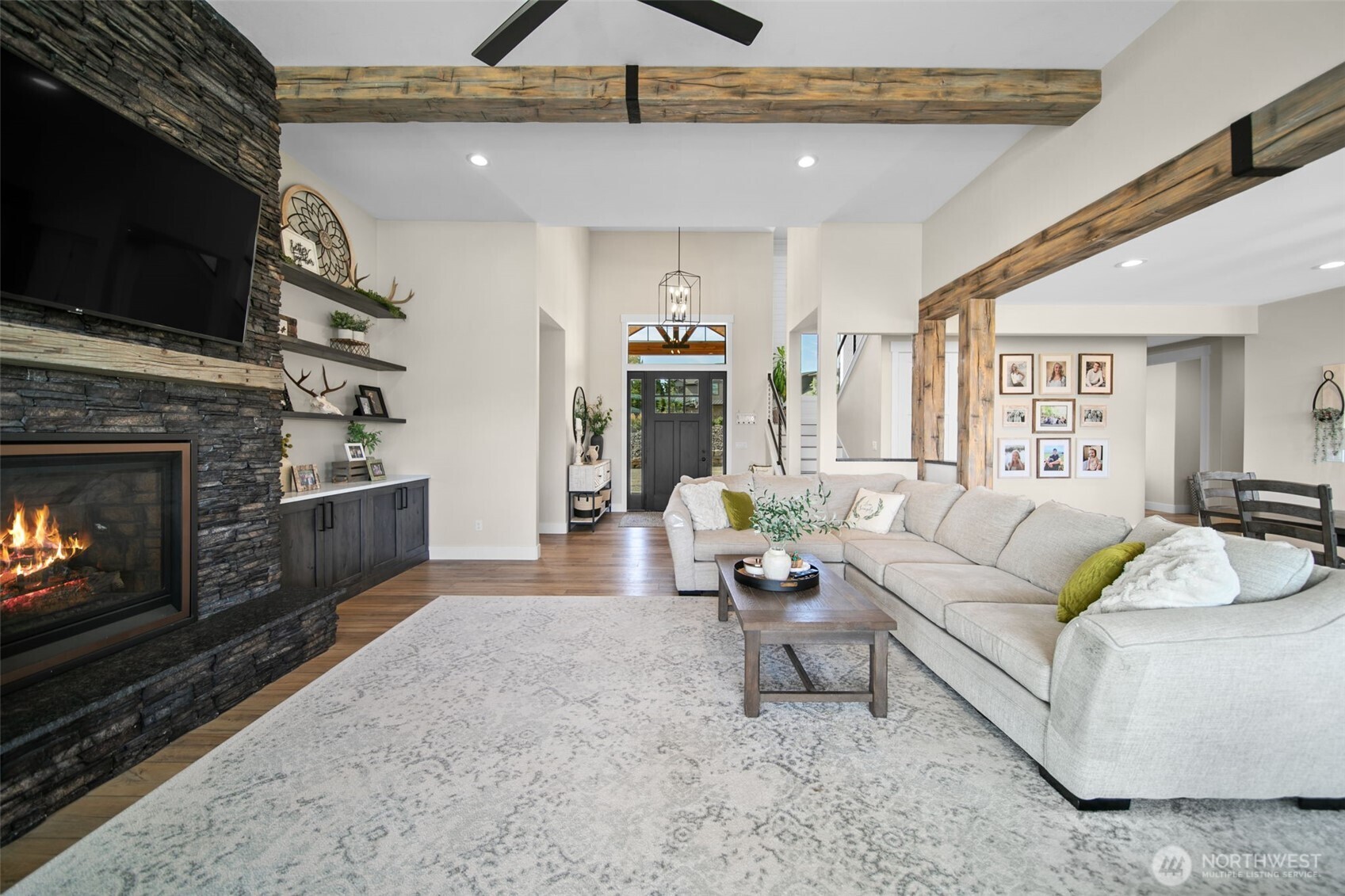 2002 North Road Wenatchee, WA 98801 - Photo 10 of 40 a living room with furniture a flat screen tv and a fireplace