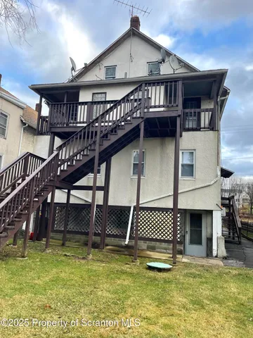 a view of a house with swimming pool and porch