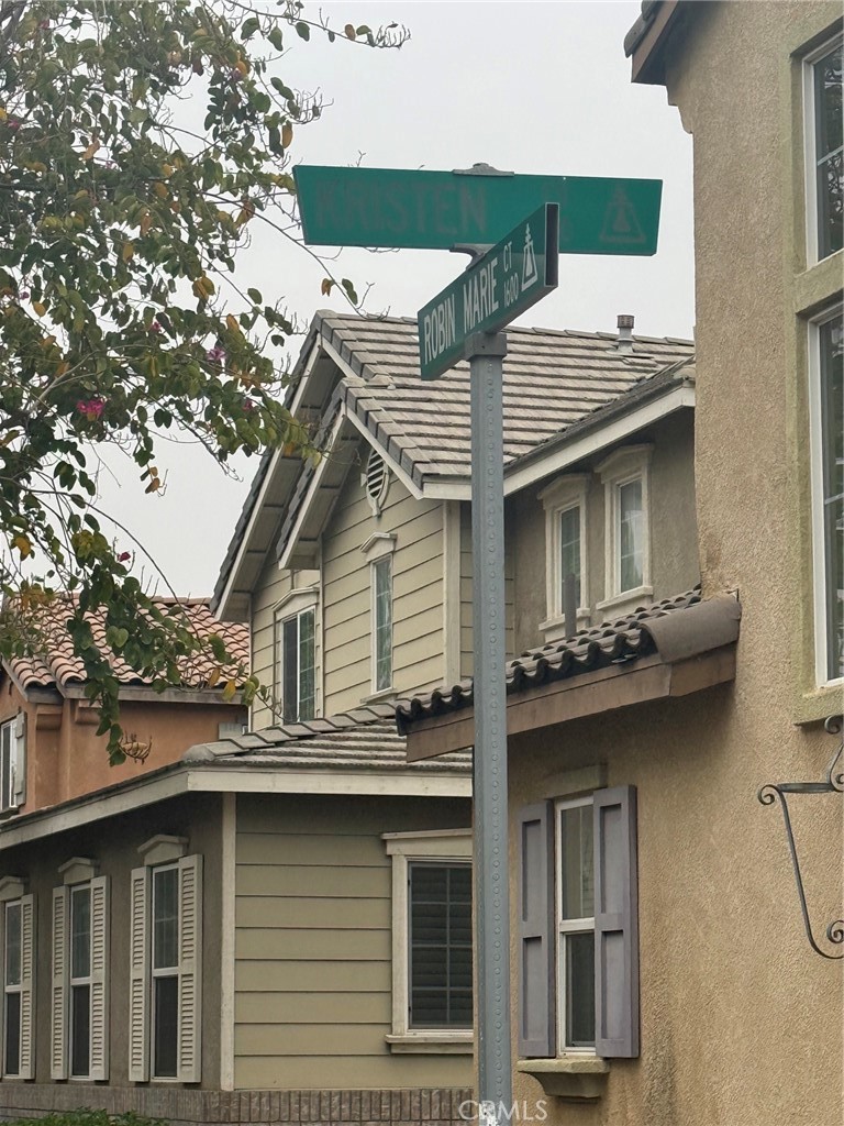 4420 Kristen Court Riverside, CA 92501 - Photo 3 of 39 STREET SIGN LEADING TO GARAGE