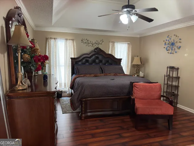 a bed room with a bed and a chandelier