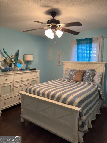 a bedroom with bed and window